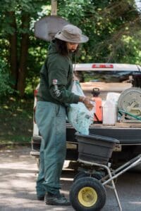 lawn care specialist loading up fertilizer